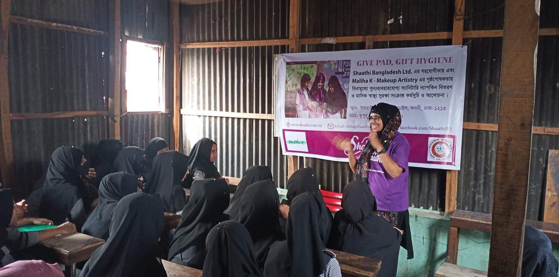 A community health worker distributing menstrual supplies
