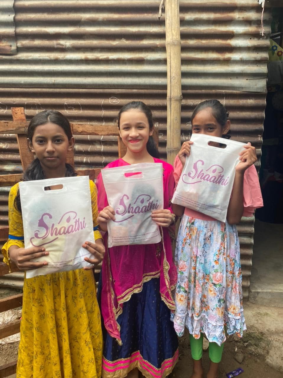 A community health worker distributing menstrual supplies